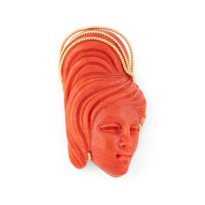 Pendentif en corail sur or jaune,représentant une tête de femme