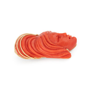 Pendentif en corail sur or jaune,représentant une tête de femme