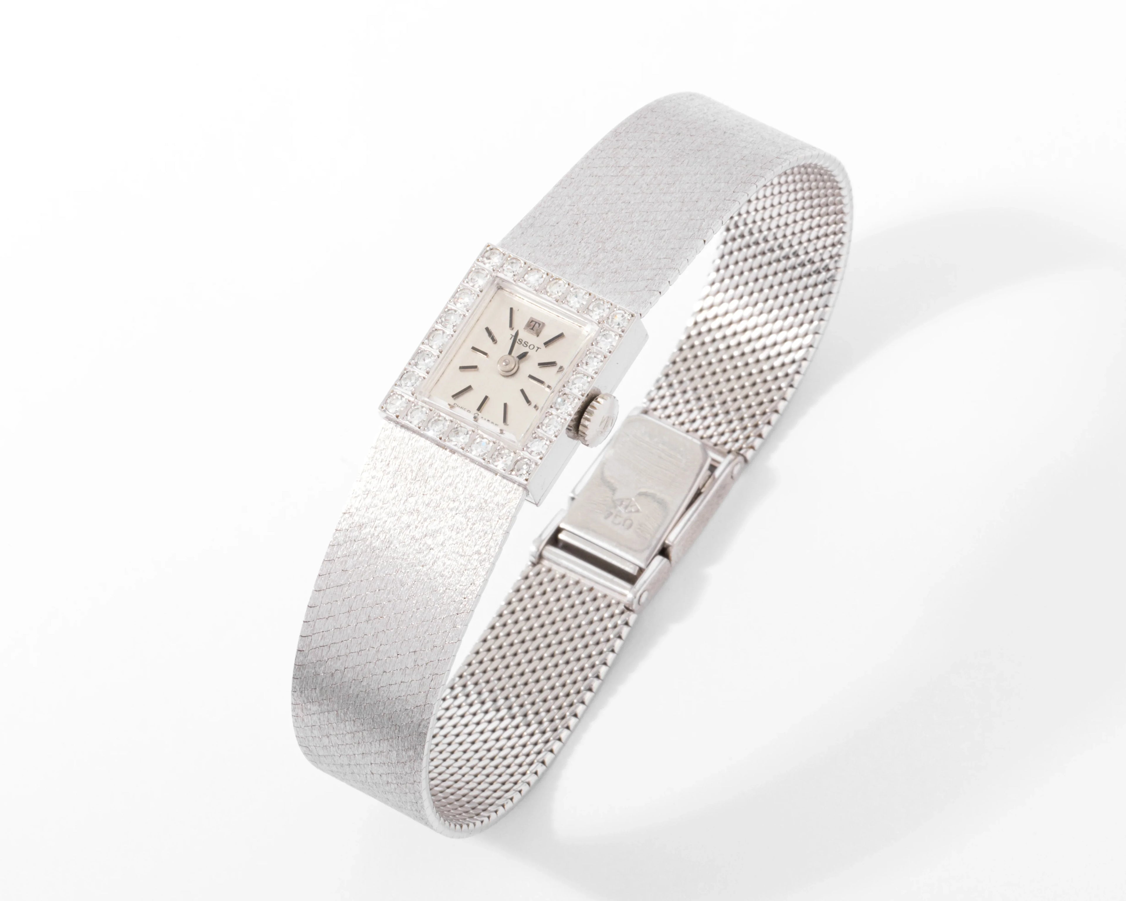 Montre Tissot or gris et diamant datant des années 1960