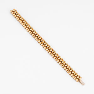 Bracelet or jaune 18k signé et numéroté de la maison Boucheron collection Grains de Raisin