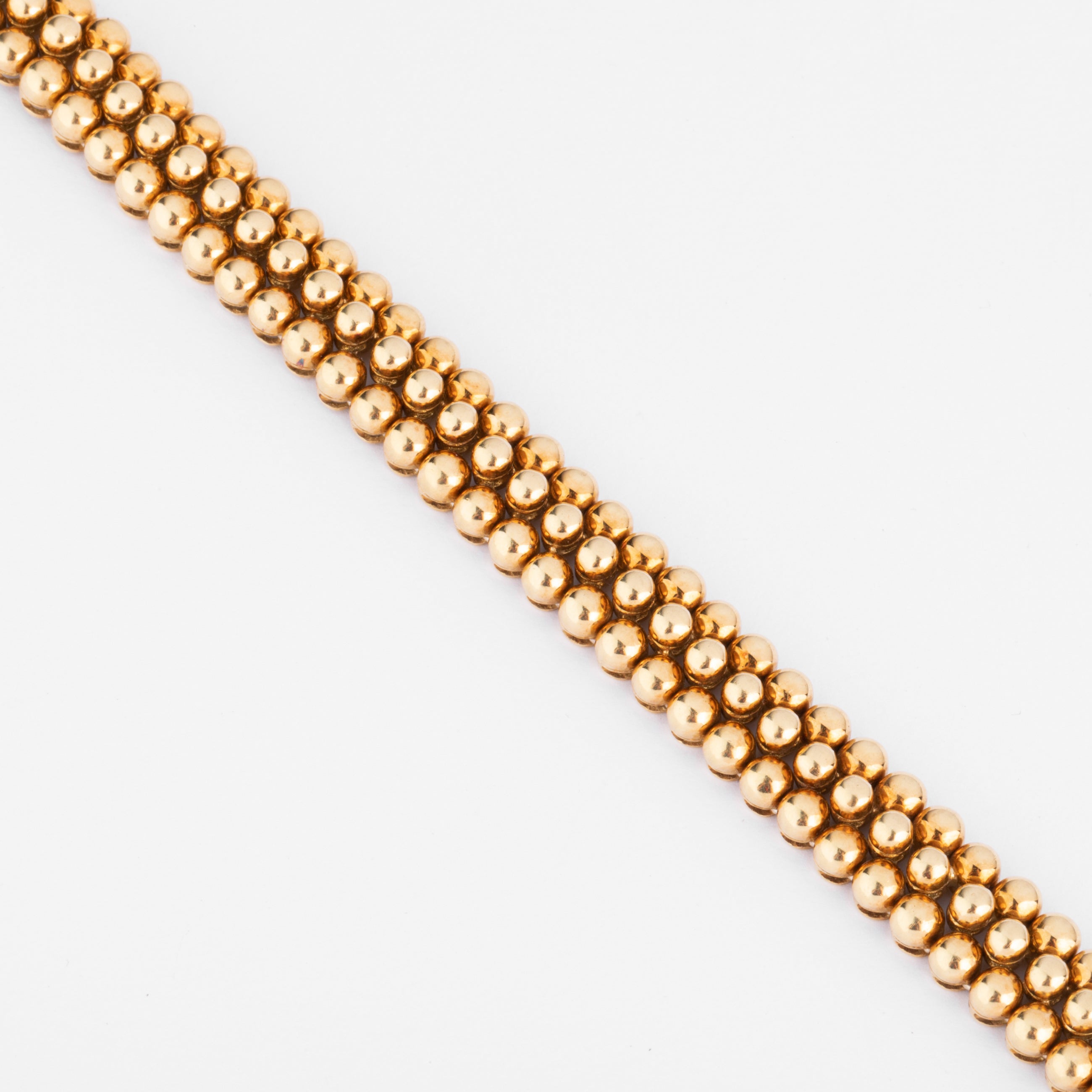 Bracelet or jaune 18k signé et numéroté de la maison Boucheron collection Grains de Raisin