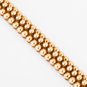 Bracelet or jaune 18k signé et numéroté de la maison Boucheron collection Grains de Raisin