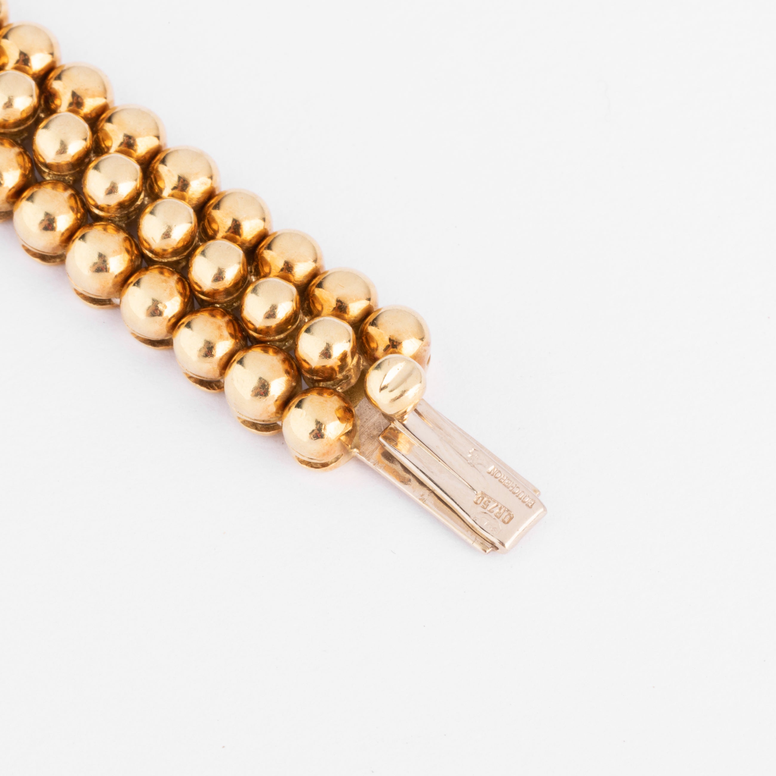 Bracelet or jaune 18k signé et numéroté de la maison Boucheron collection Grains de Raisin