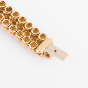 Bracelet or jaune 18k signé et numéroté de la maison Boucheron collection Grains de Raisin