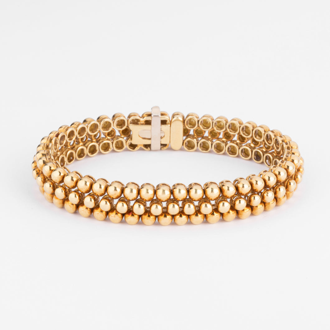 Bracelet or jaune 18k signé et numéroté de la maison Boucheron collection Grains de Raisin