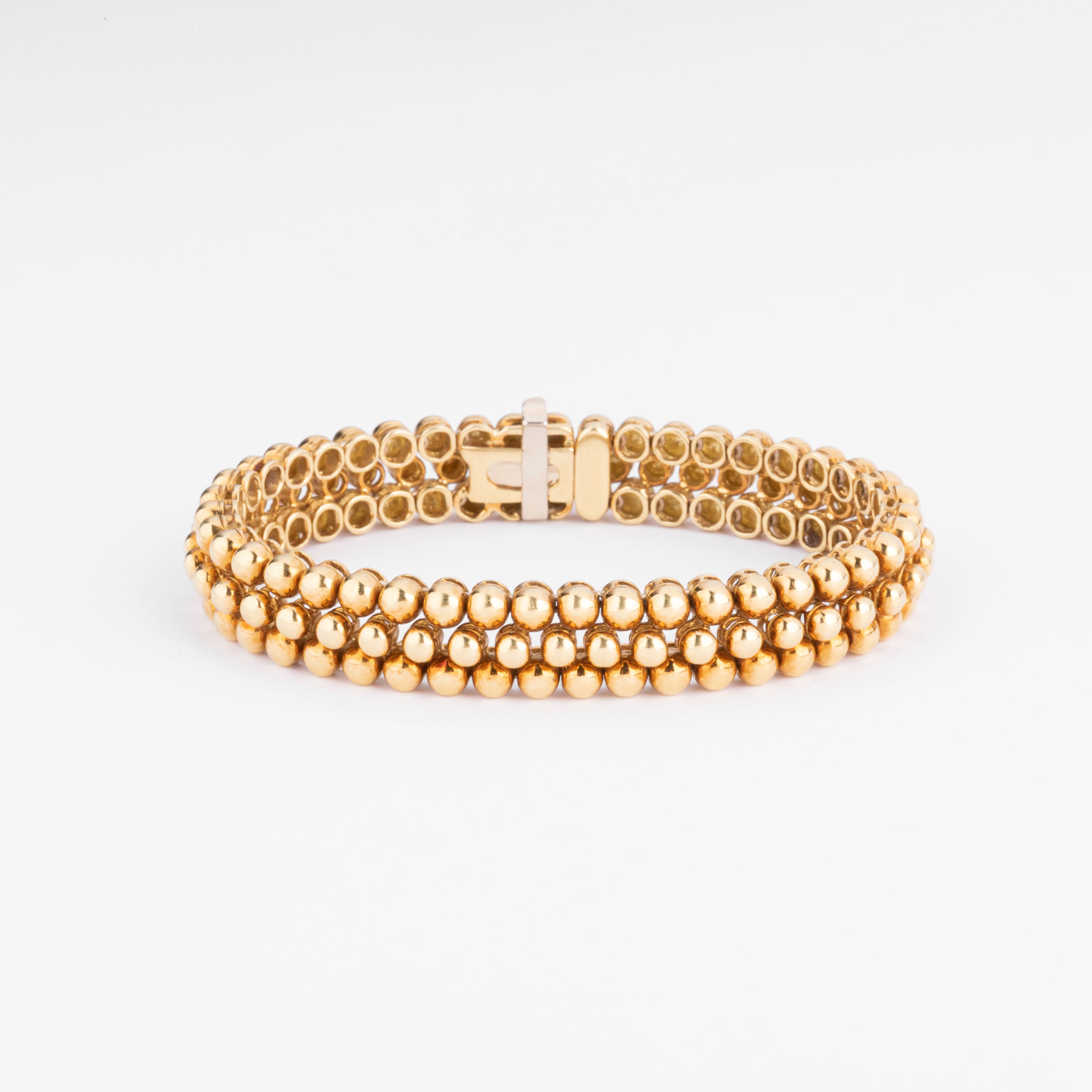 Bracelet or jaune 18k signé et numéroté de la maison Boucheron collection Grains de Raisin
