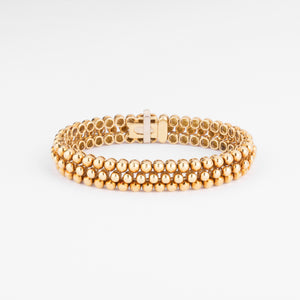 Bracelet or jaune 18k signé et numéroté de la maison Boucheron collection Grains de Raisin