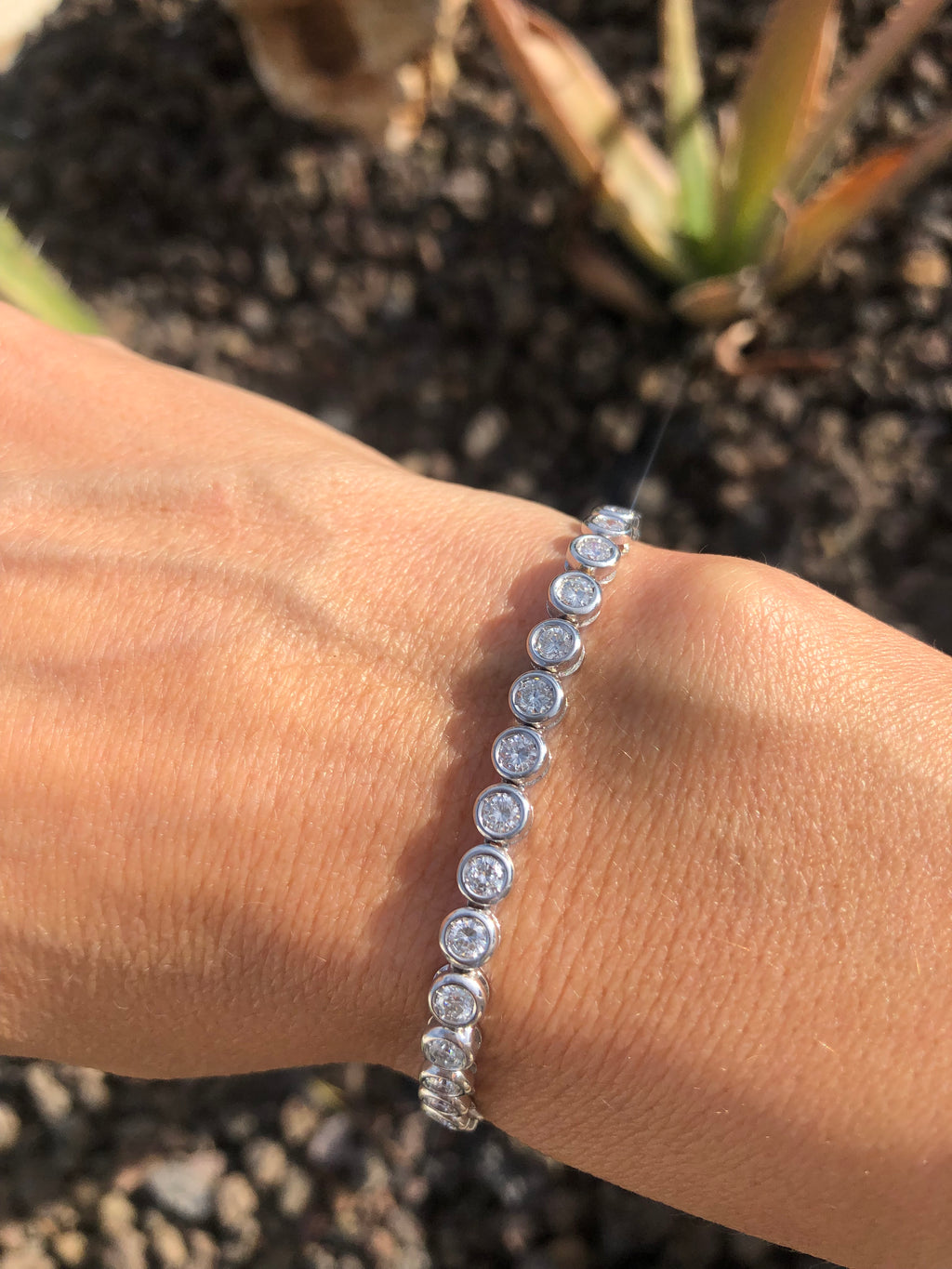 Bracelet en or gris et diamants tennis serti tennis