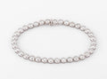 Bracelet en or gris et diamants tennis serti tennis