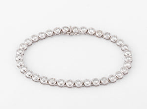 Bracelet en or gris et diamants tennis serti tennis