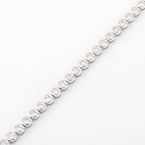 Bracelet en or gris et diamants tennis serti tennis
