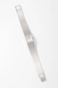 Montre Tissot or gris et diamant datant des années 1960