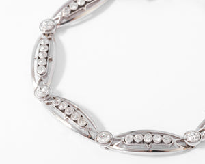 Bracelet or platine et et diamant formant des maillons ovales