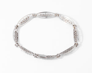 Bracelet or platine et et diamant formant des maillons ovales