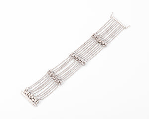 Bracelet or gris et diamant sur chaine força limée alternée de 4 motifs avec des fleurs